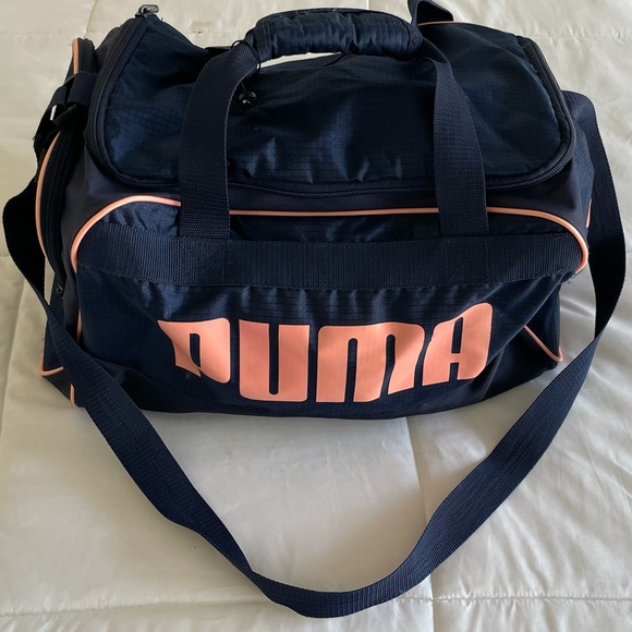 A navy blue and baby pink Puma duffel bag. - Picture 2 of 7